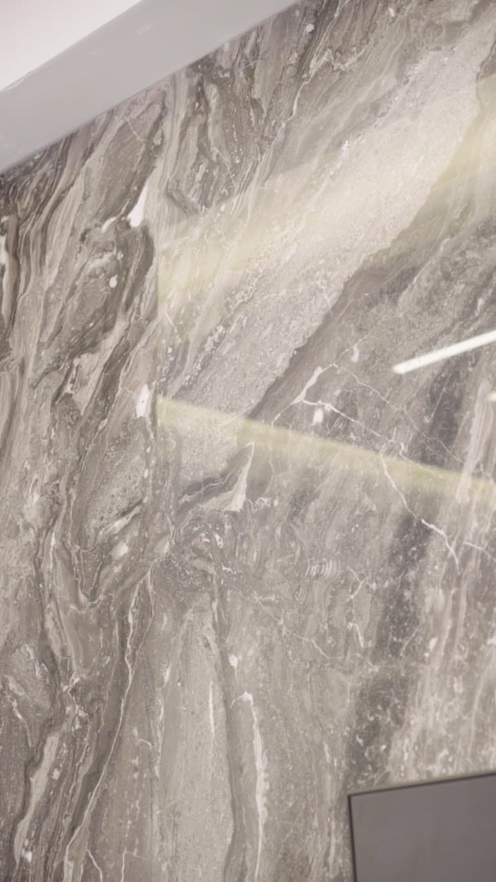 Close view of grey-veined marble with a contemporary interior