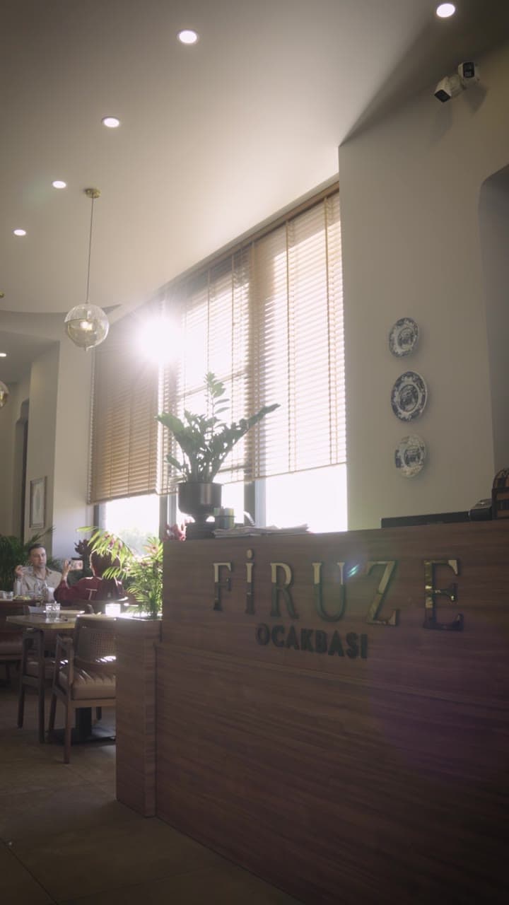 Daylight restaurant interior with an arranged seating area