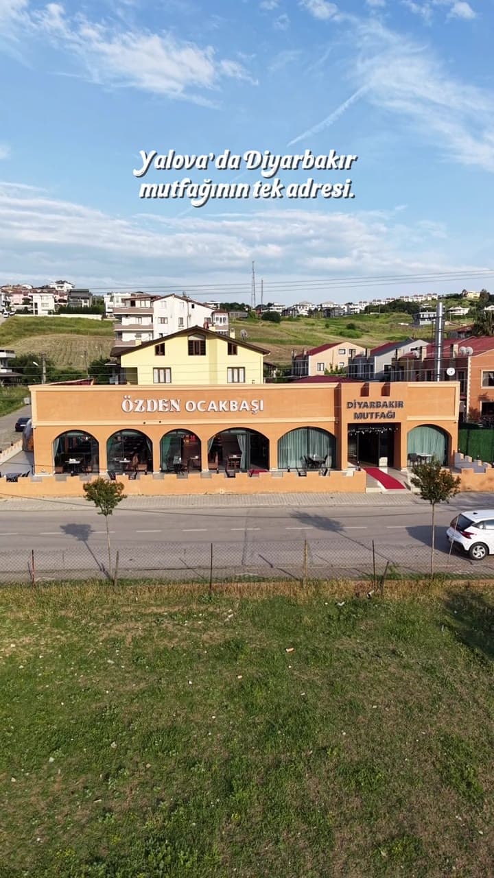 Aerial exterior view of an ocakbaşı restaurant with Yalova visible in the copy